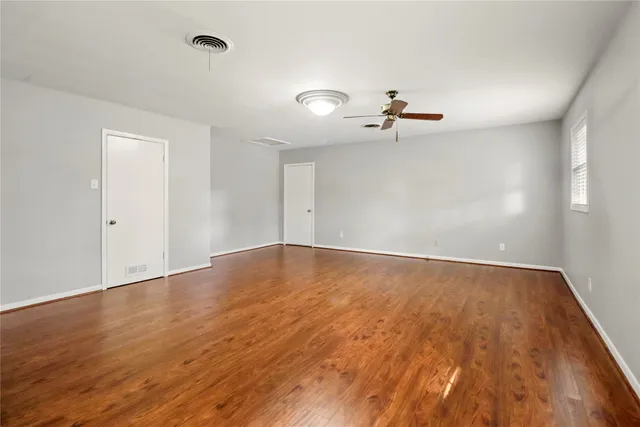 a kitchen with a sink and large cabinets
