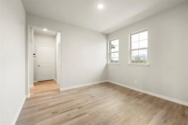 a kitchen with cabinets stainless steel appliances and a sink