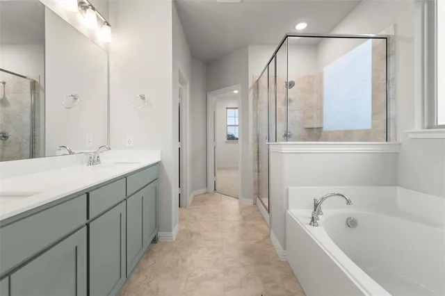 a bathroom with a glass shower door