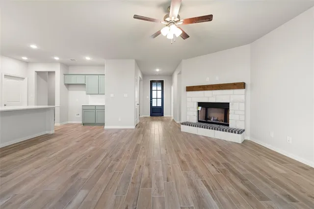 a view of a house with yard and lake view