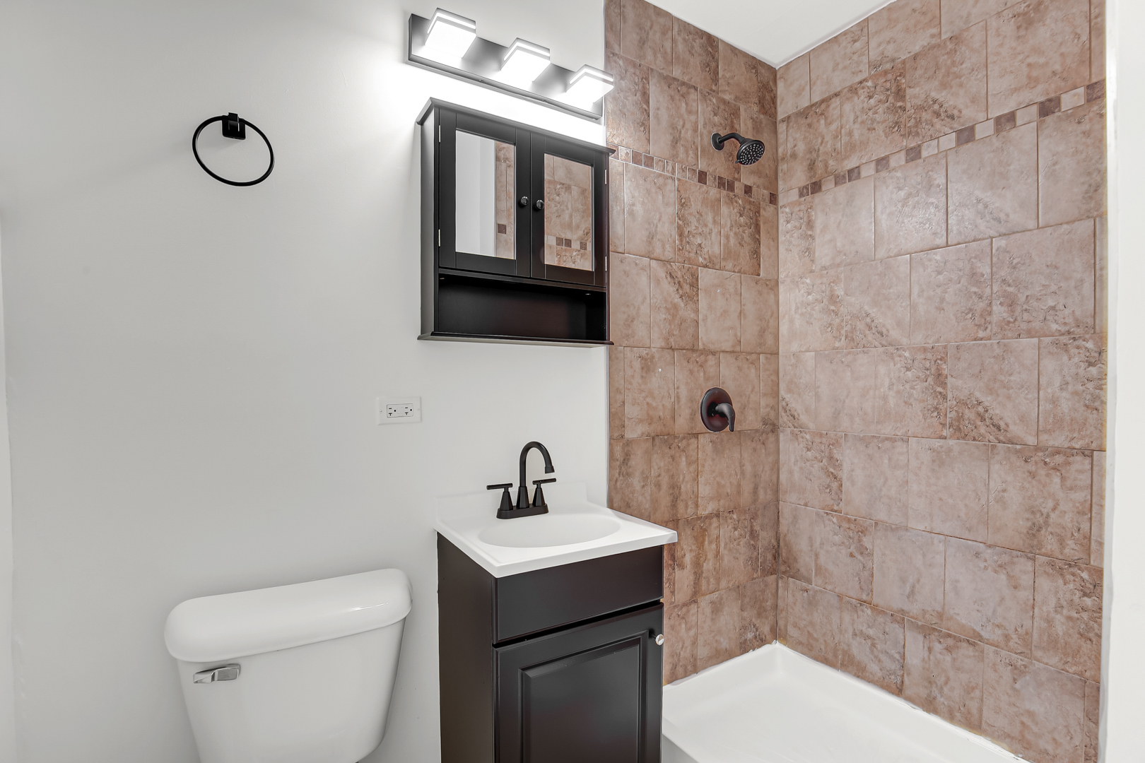 18548 Lyn Court Homewood, IL 60430 - Photo 12 of 16 a bathroom with a toilet a sink and mirror