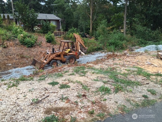 0 Military Road South Seattle, WA 98198 - Photo 8 of 10 a view of backyard with a table and chairs under an umbrella