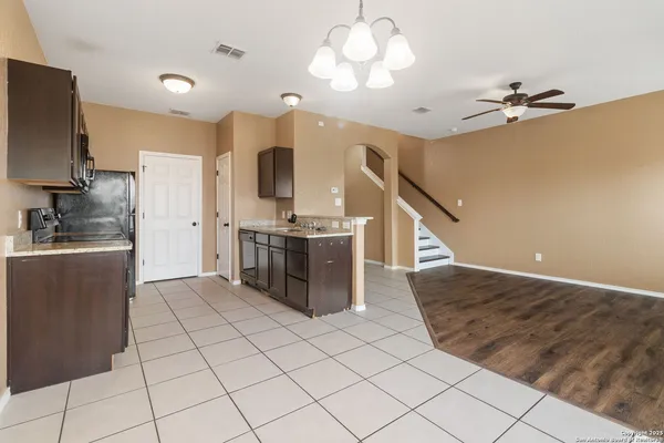 a kitchen with stainless steel appliances a refrigerator and a stove top oven