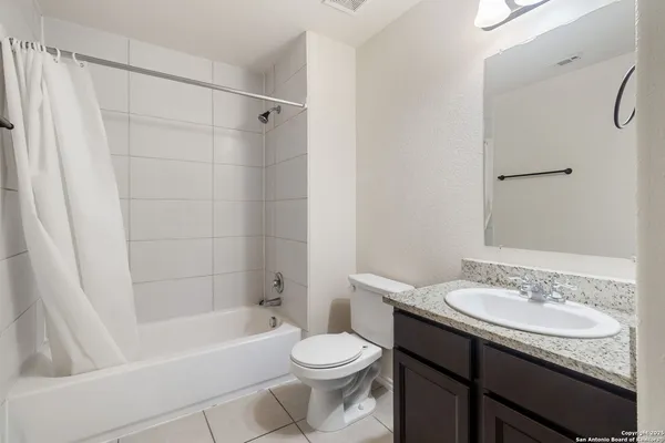 a bathroom with a sink a toilet and a bathtub