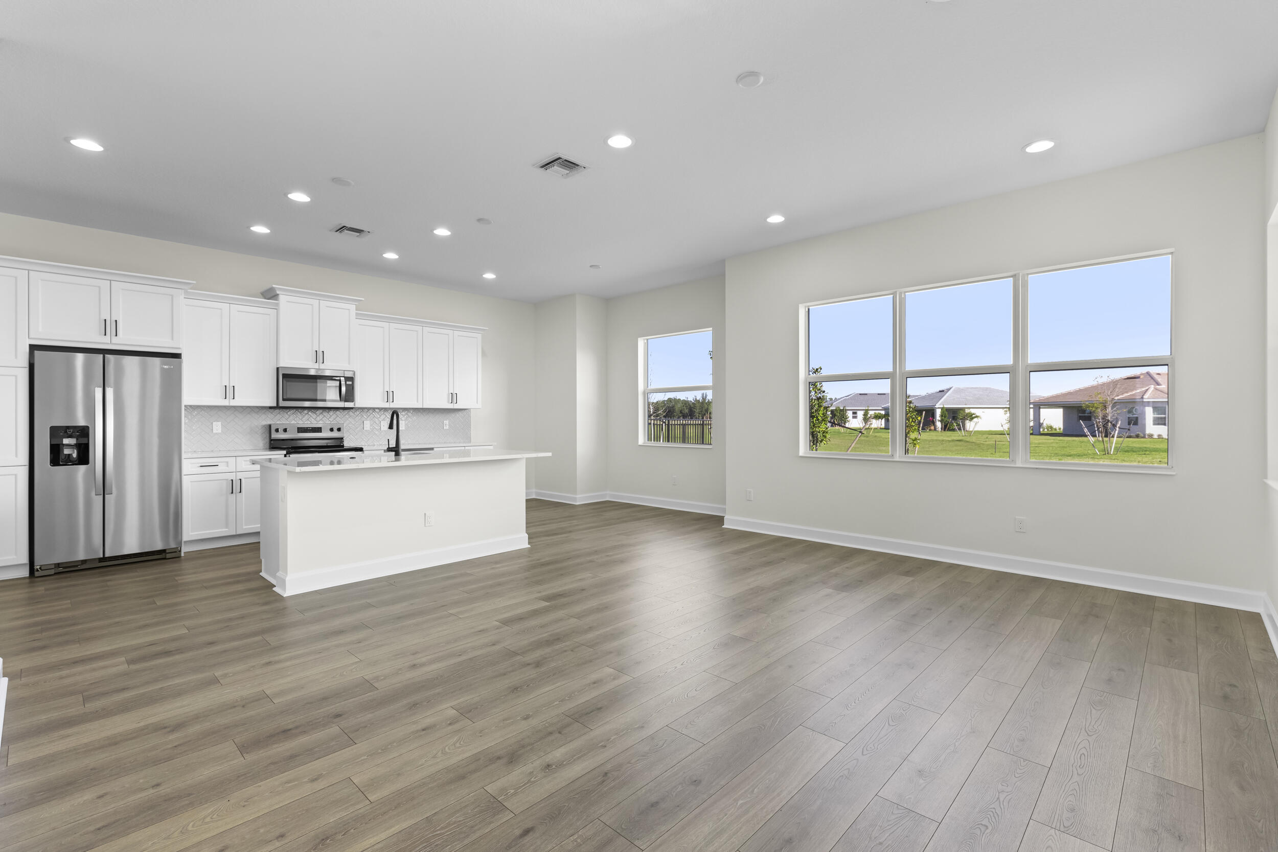 14159 Gray Bark Bend Westlake, FL 33470 - Photo 12 of 87 a view of kitchen with stainless steel appliances refrigerator oven and cabinets