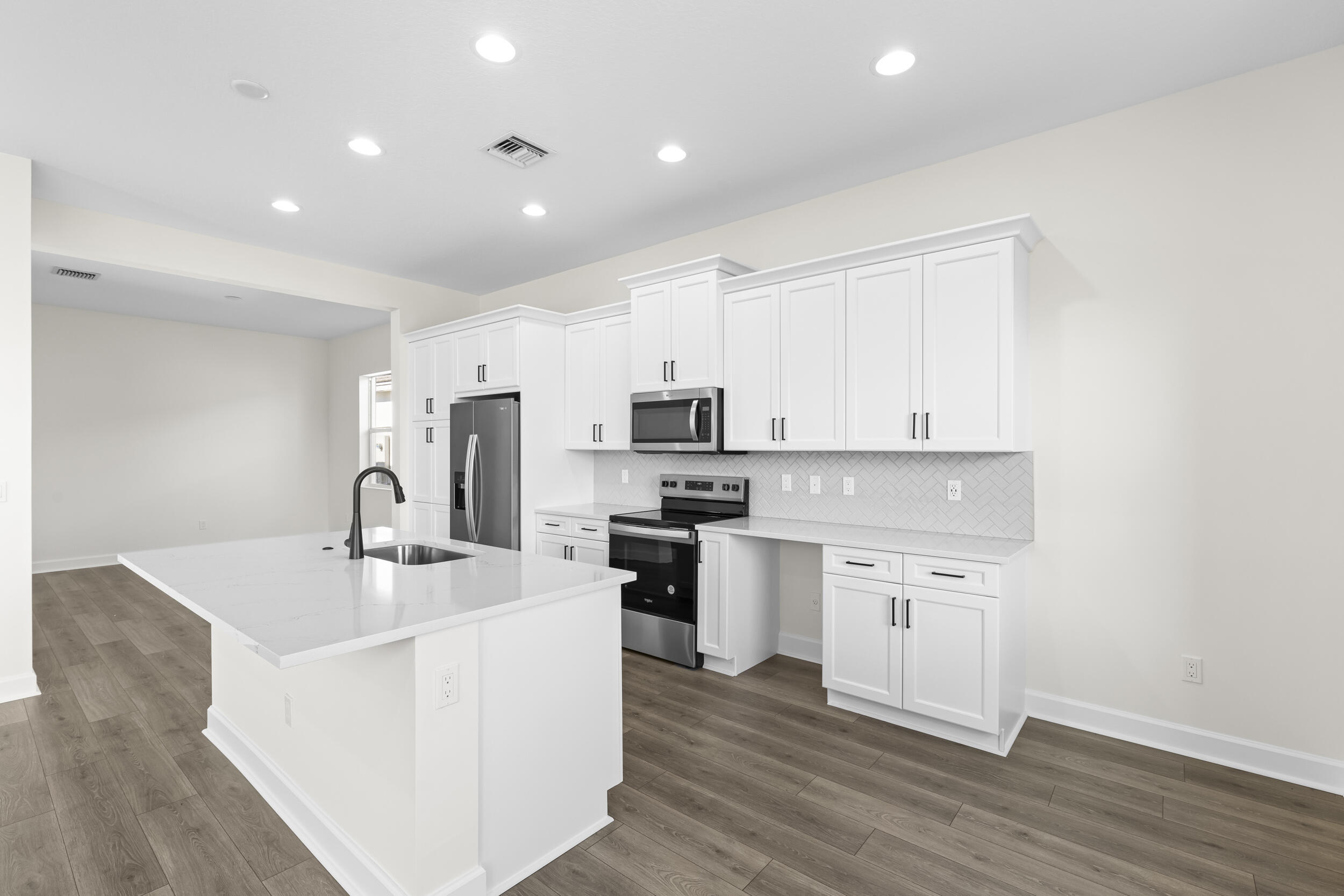 14159 Gray Bark Bend Westlake, FL 33470 - Photo 17 of 87 a kitchen with stainless steel appliances granite countertop a sink stove and refrigerator