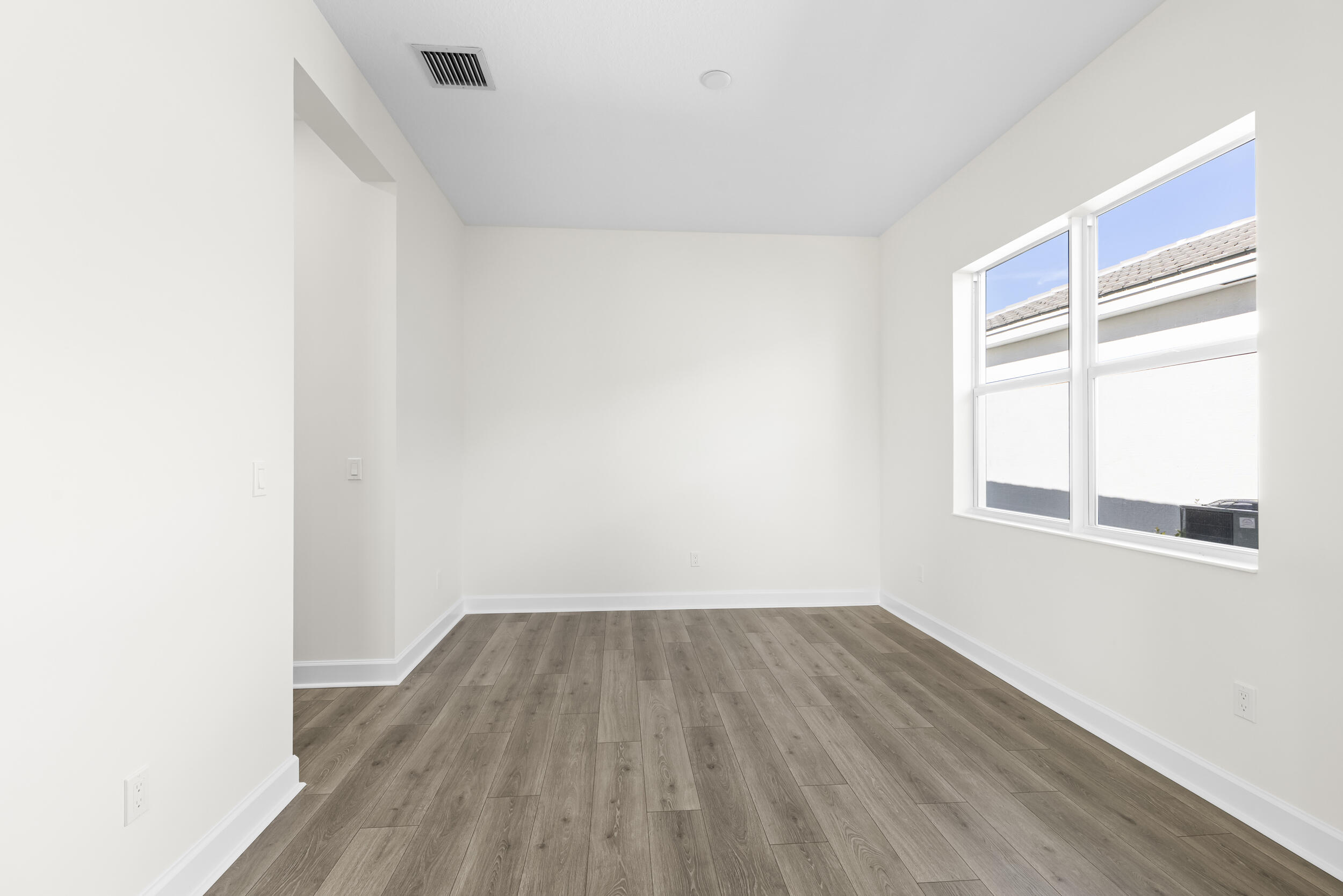14159 Gray Bark Bend Westlake, FL 33470 - Photo 23 of 87 a view of a room with wooden floor and windows