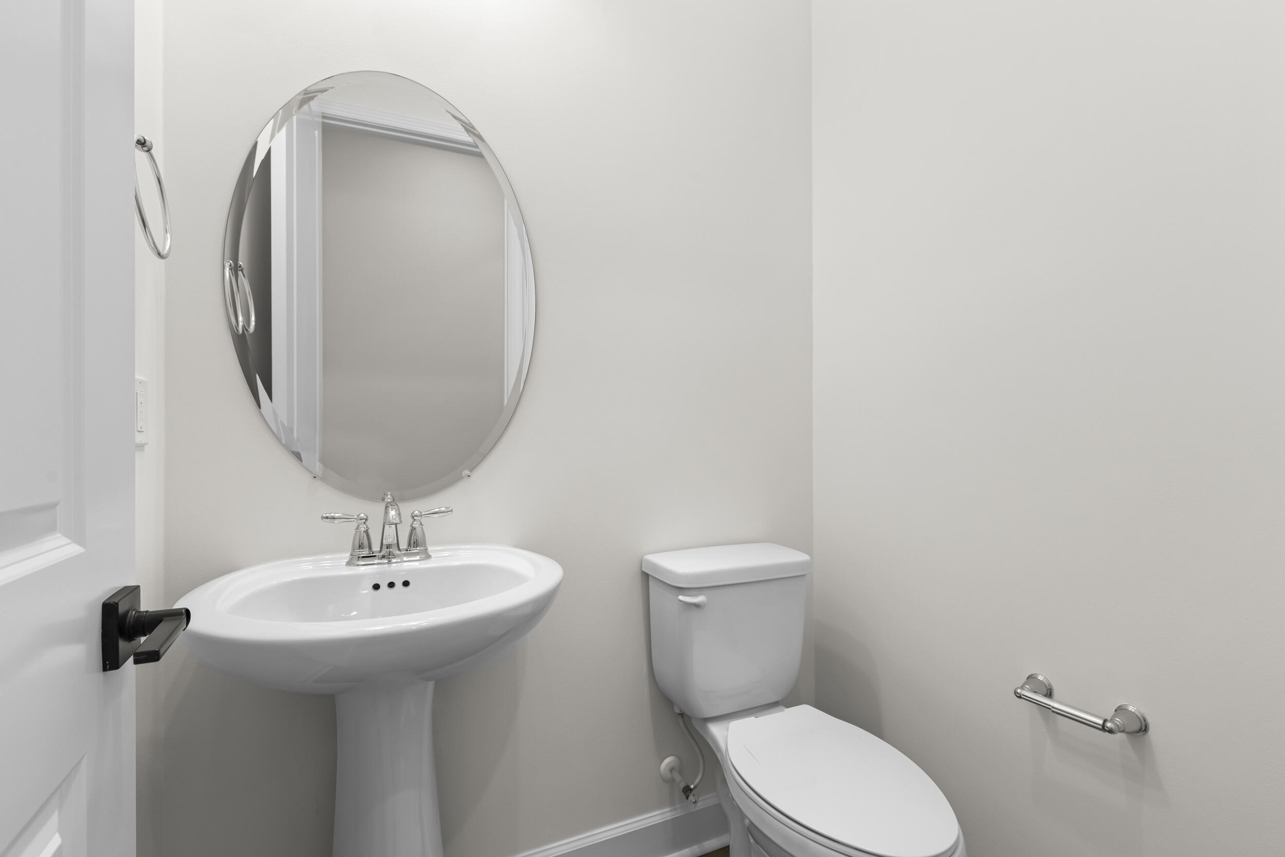 14159 Gray Bark Bend Westlake, FL 33470 - Photo 25 of 87 a bathroom with a toilet sink and mirror
