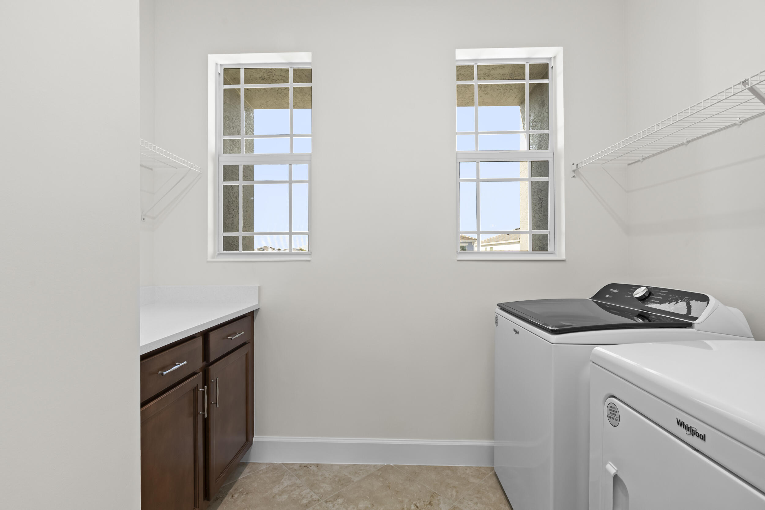 14159 Gray Bark Bend Westlake, FL 33470 - Photo 27 of 87 a utility room with closet dryer and washer