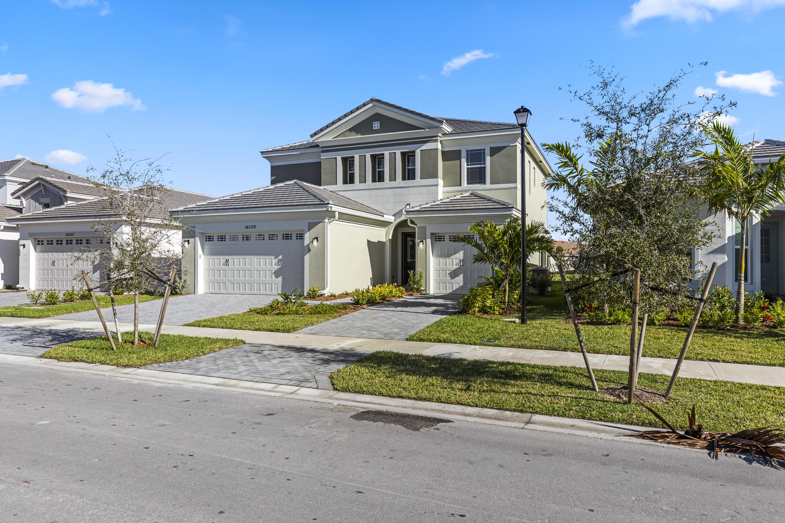 14159 Gray Bark Bend Westlake, FL 33470 - Photo 3 of 87 a front view of a house with a yard