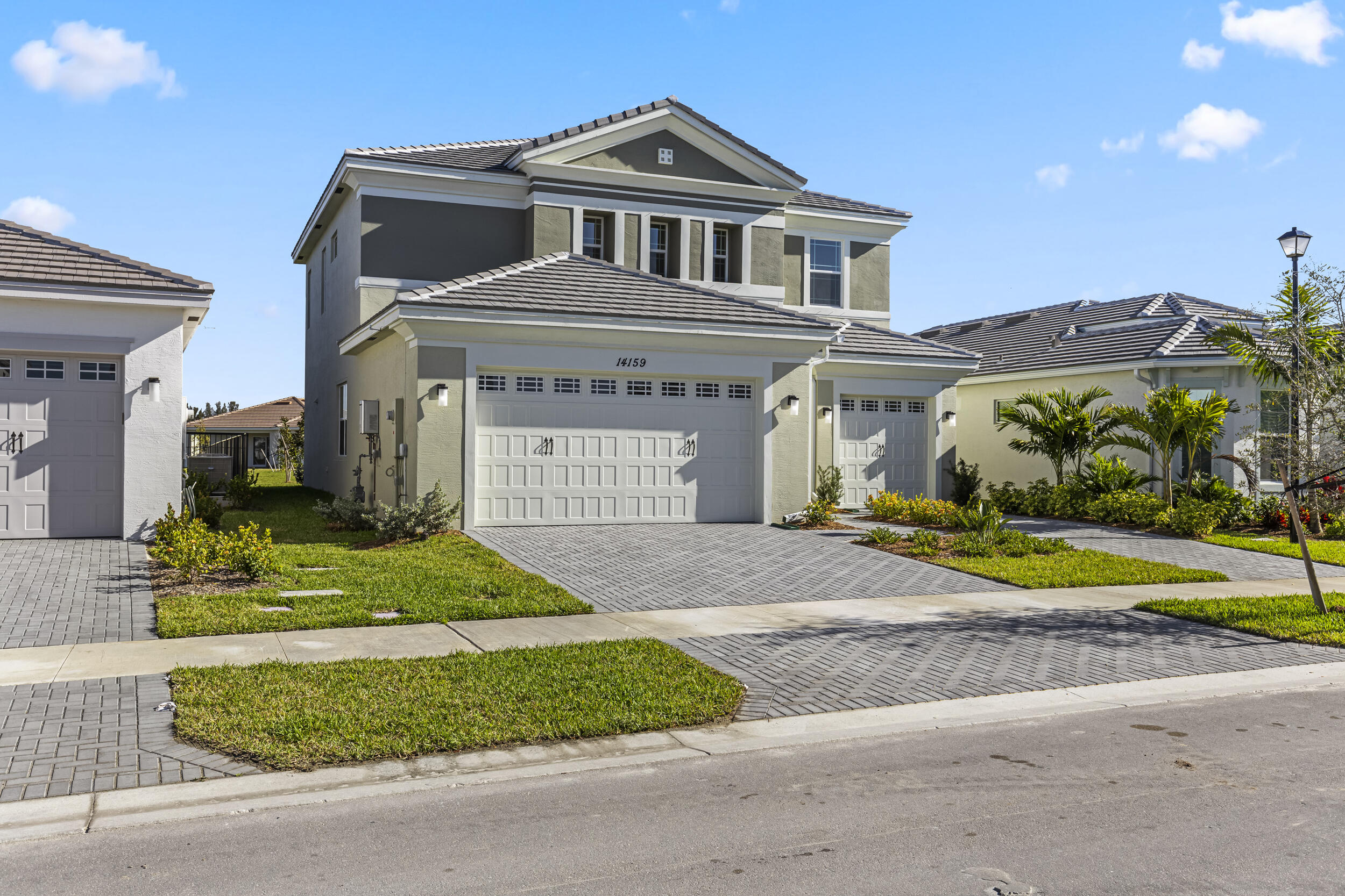 14159 Gray Bark Bend Westlake, FL 33470 - Photo 4 of 87 a front view of a house with a yard