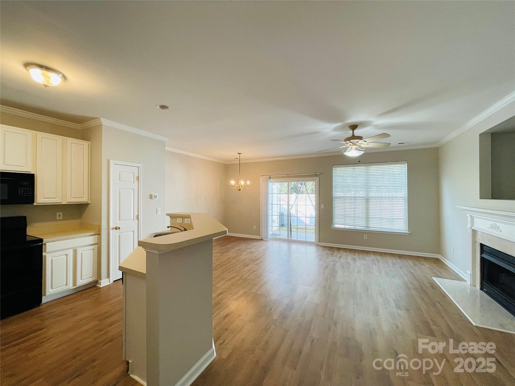 724 Shellstone Place Fort Mill, SC 29708 - Photo 4 of 17 a view of a kitchen with furniture and wooden floor