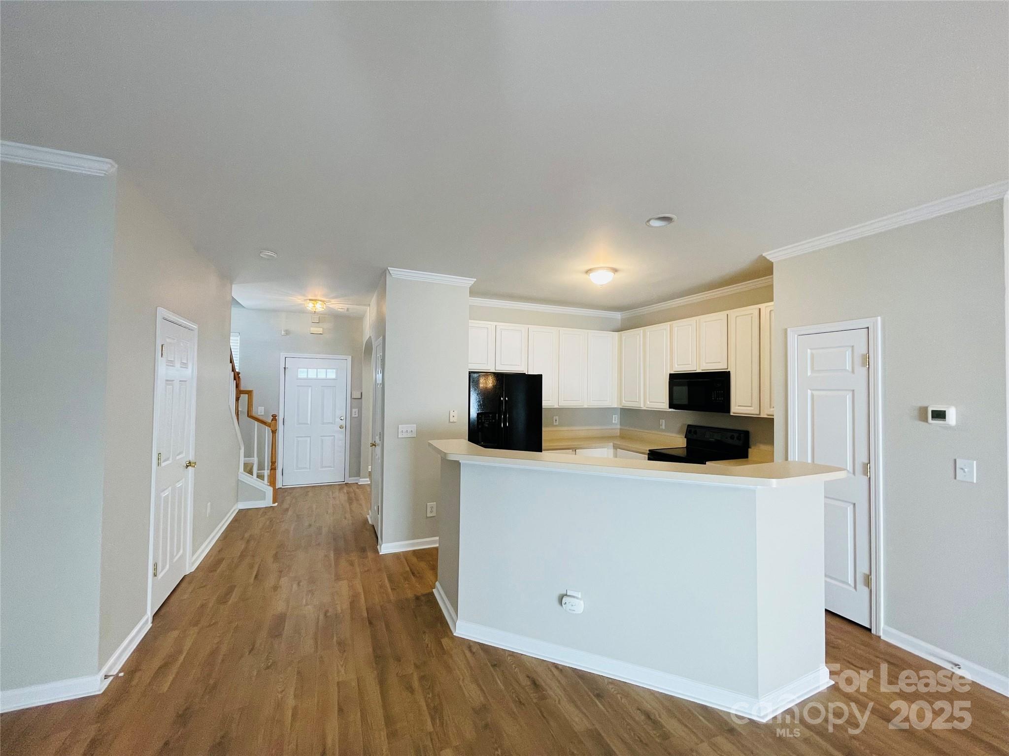 724 Shellstone Place Fort Mill, SC 29708 - Photo 5 of 17 a view of a kitchen with a sink and a refrigerator