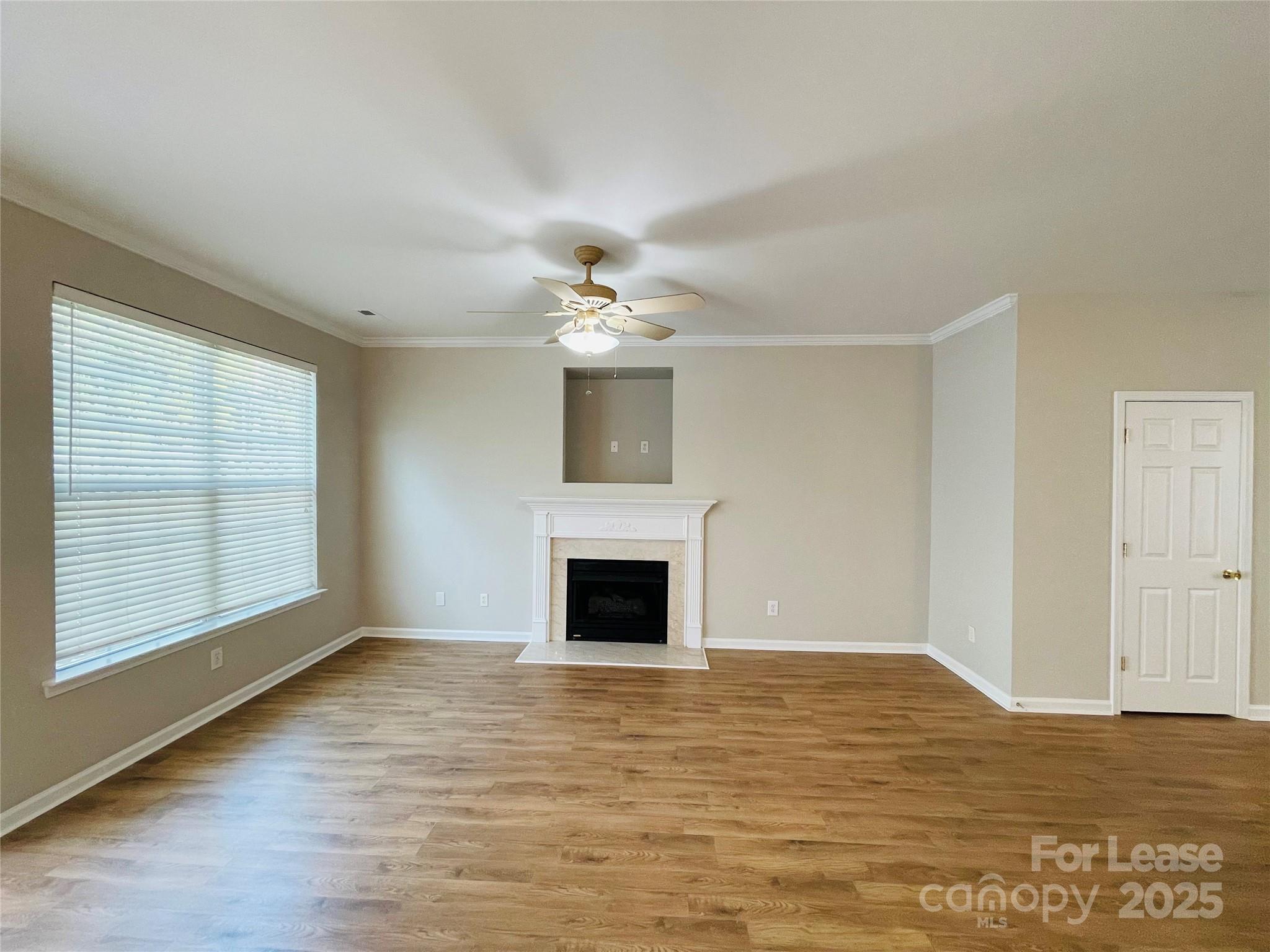 724 Shellstone Place Fort Mill, SC 29708 - Photo 6 of 17 a view of a livingroom with a fireplace and window