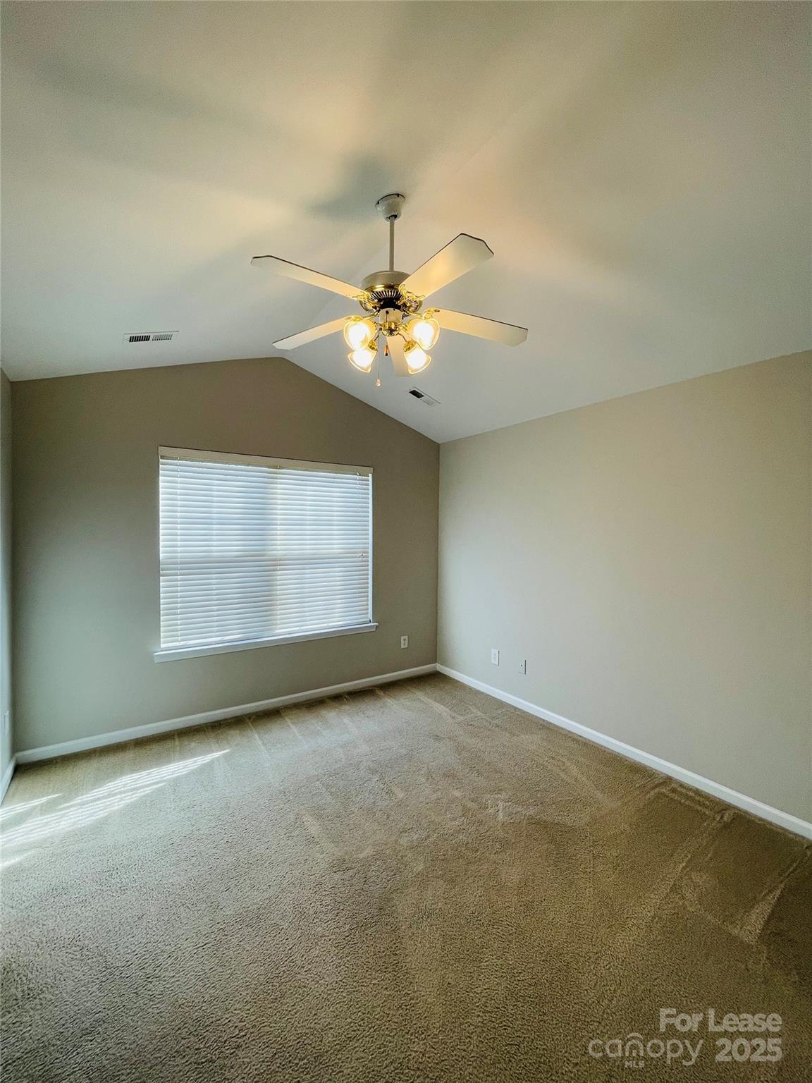 724 Shellstone Place Fort Mill, SC 29708 - Photo 8 of 17 an empty room with windows and fan