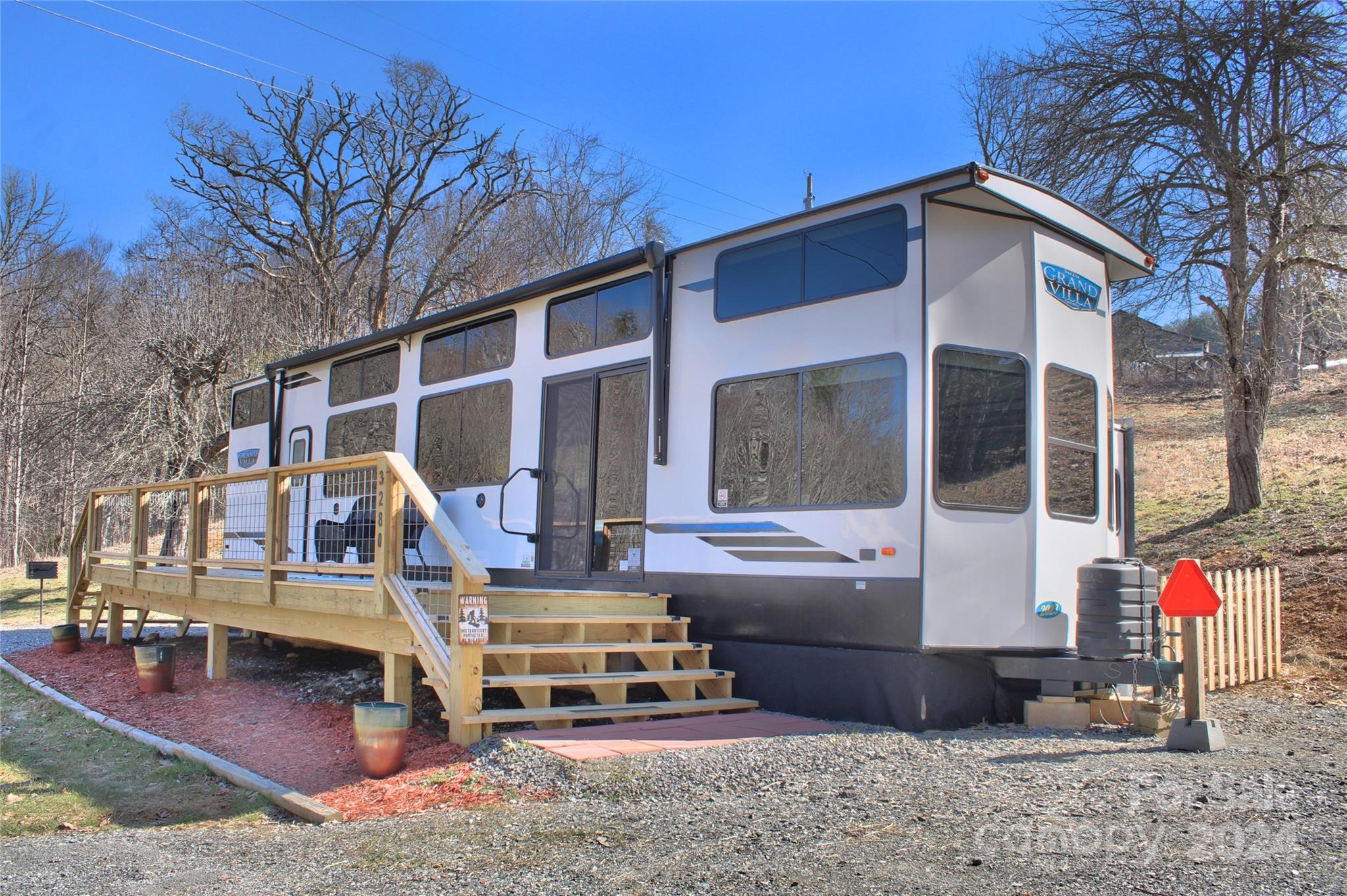 a view of a house with a yard patio and furniture