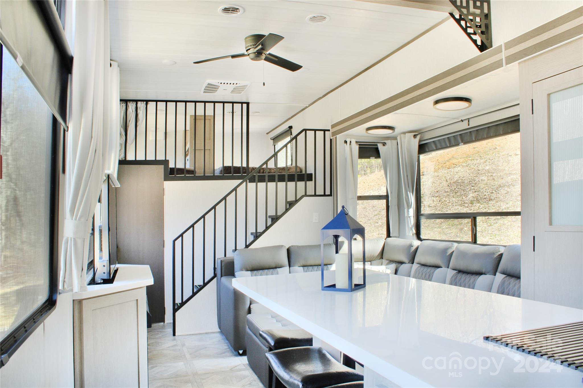 3280 Laurel Valley Road Mars Hill, NC 28754 - Photo 12 of 21 a dining room with wooden floor and furniture