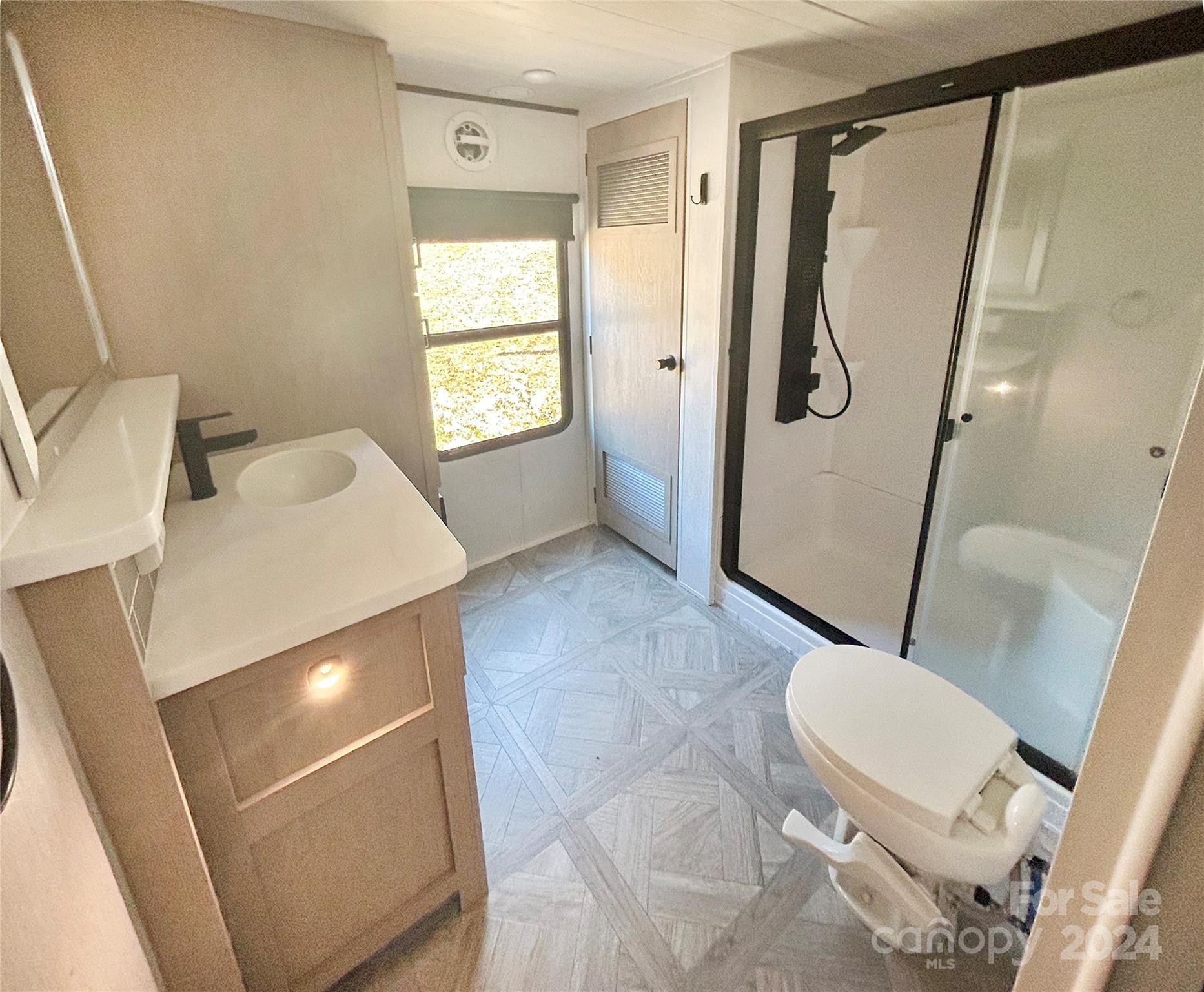 3280 Laurel Valley Road Mars Hill, NC 28754 - Photo 16 of 21 a bathroom with a sink and a mirror