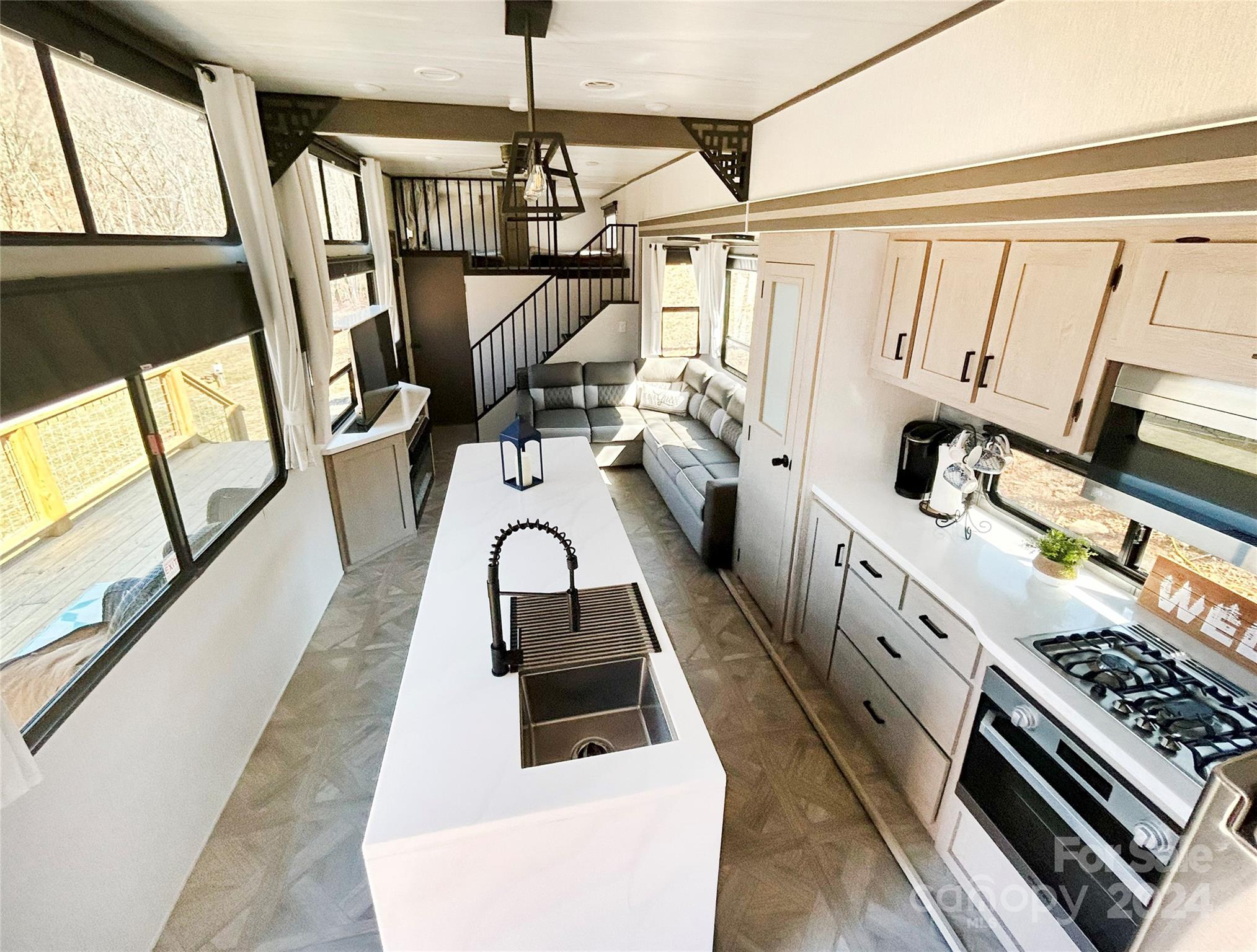 3280 Laurel Valley Road Mars Hill, NC 28754 - Photo 3 of 21 a kitchen with stainless steel appliances a stove a sink and a refrigerator