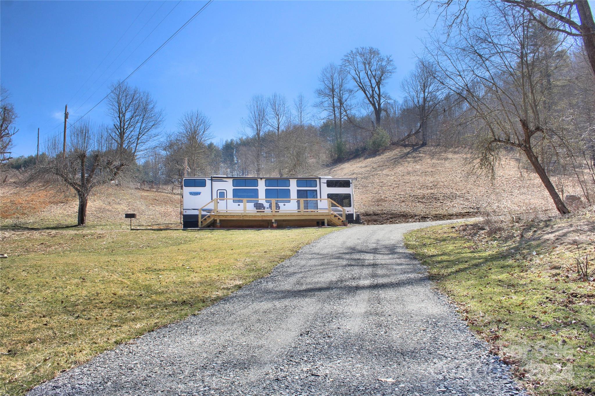 3280 Laurel Valley Road Mars Hill, NC 28754 - Photo 6 of 21 a view of a house with a yard