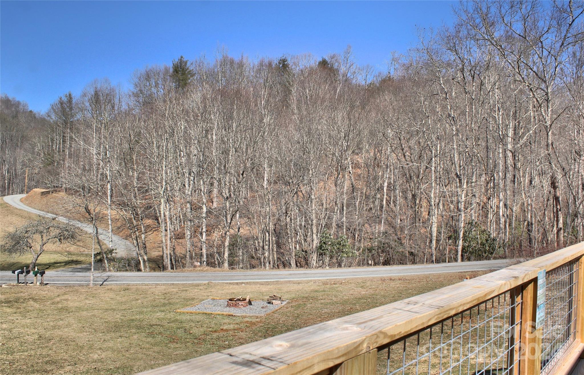 3280 Laurel Valley Road Mars Hill, NC 28754 - Photo 9 of 21 a view of a field with trees in the background