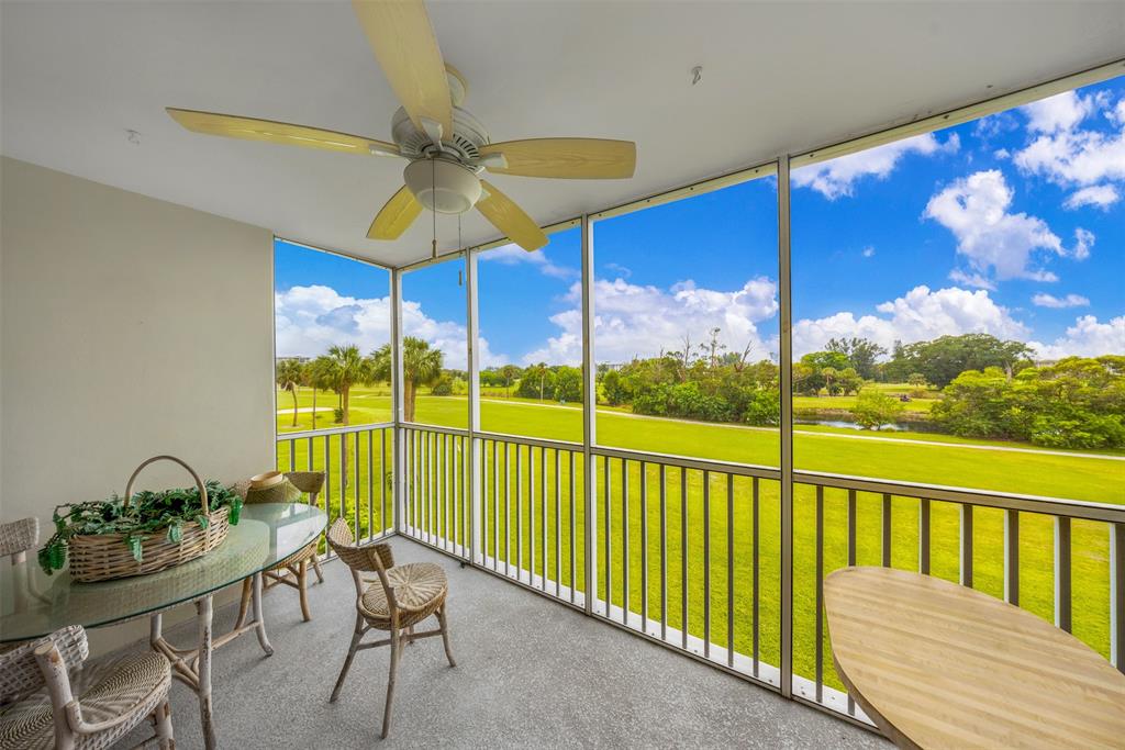 3000 North Palm Aire Drive, Unit 302 Pompano Beach, FL 33069 - Photo 12 of 23 a view of a balcony with furniture
