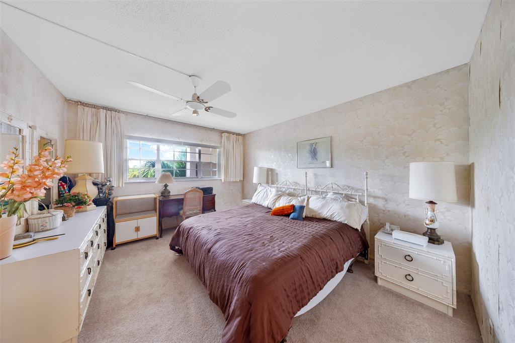 3000 North Palm Aire Drive, Unit 302 Pompano Beach, FL 33069 - Photo 14 of 23 a bed room with bed and window