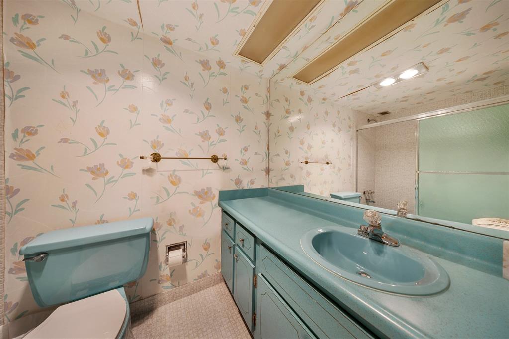 3000 North Palm Aire Drive, Unit 302 Pompano Beach, FL 33069 - Photo 16 of 23 a bathroom with a sink toilet and mirror