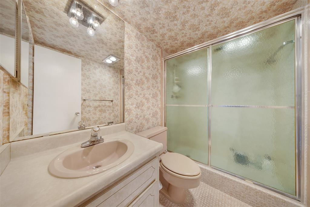 3000 North Palm Aire Drive, Unit 302 Pompano Beach, FL 33069 - Photo 20 of 23 a bathroom with a sink a toilet and shower