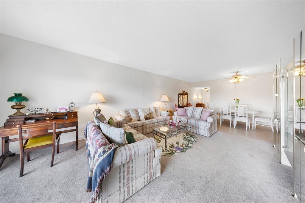 3000 North Palm Aire Drive, Unit 302 Pompano Beach, FL 33069 - Photo 4 of 23 a living room with furniture and a couch