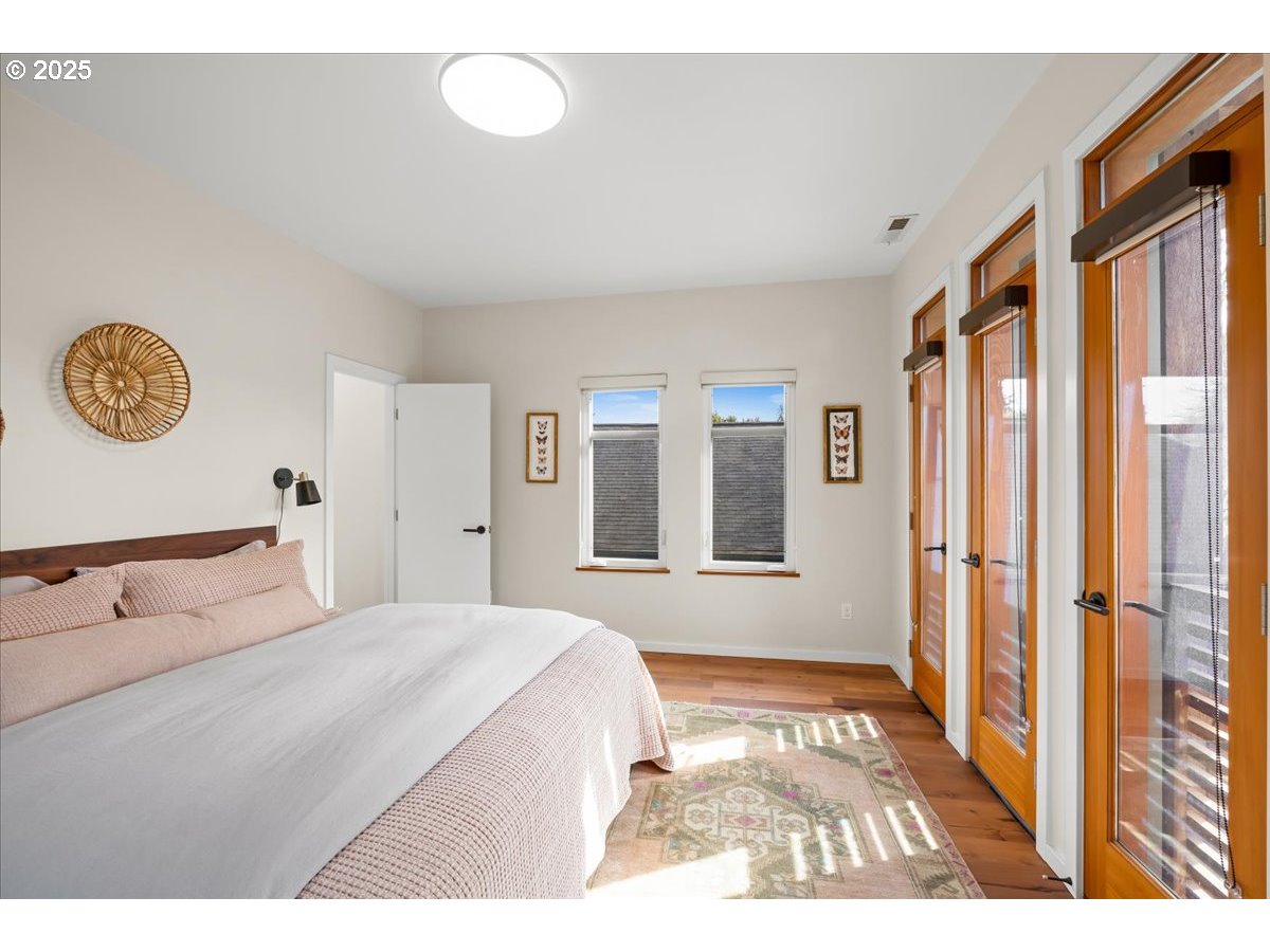 8316 Southeast 7th Avenue Portland, OR 97202 - Photo 16 of 44 a bedroom with a bed and a window