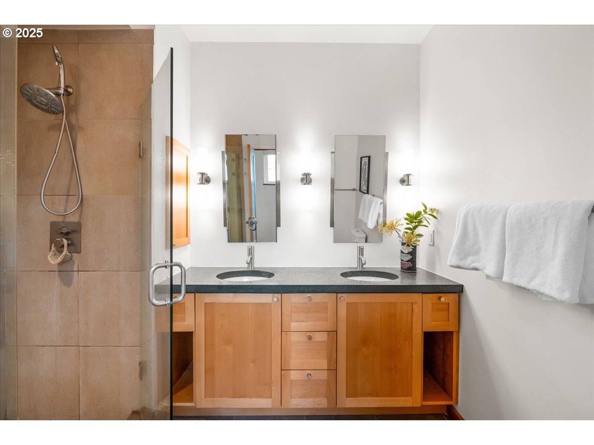 8316 Southeast 7th Avenue Portland, OR 97202 - Photo 19 of 44 a bathroom with a granite countertop sink mirror and vanity