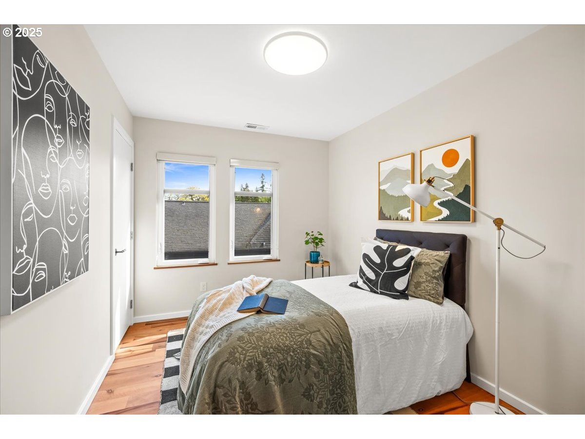 8316 Southeast 7th Avenue Portland, OR 97202 - Photo 25 of 44 a bedroom with a bed and a window