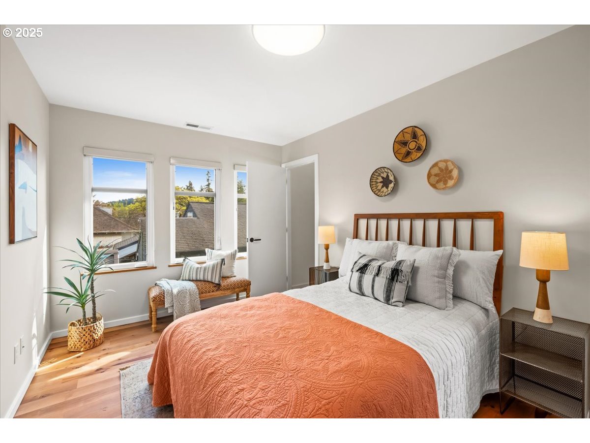 8316 Southeast 7th Avenue Portland, OR 97202 - Photo 27 of 44 a bedroom with a bed and a table