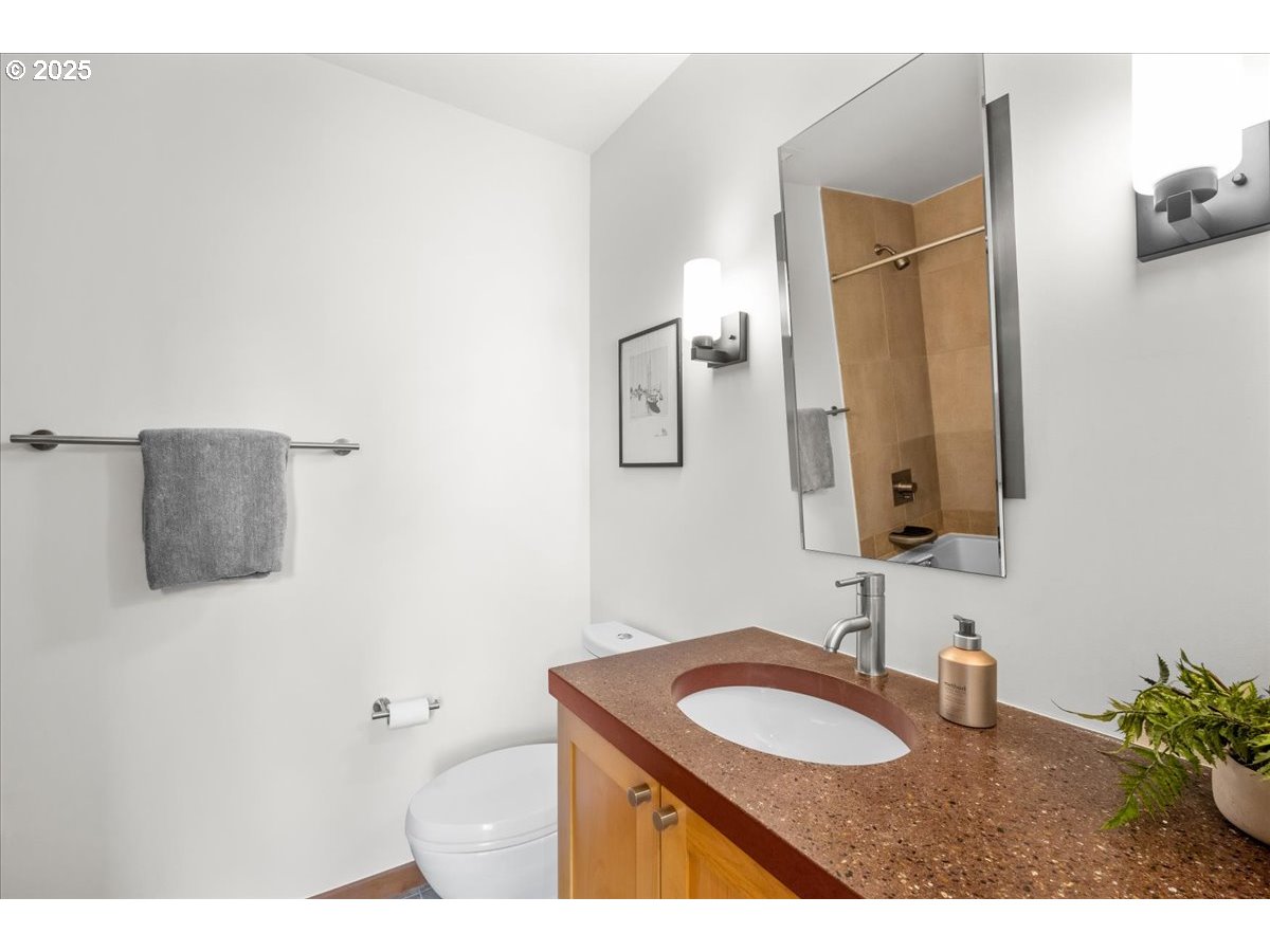 8316 Southeast 7th Avenue Portland, OR 97202 - Photo 28 of 44 a bathroom with a granite countertop sink and a mirror