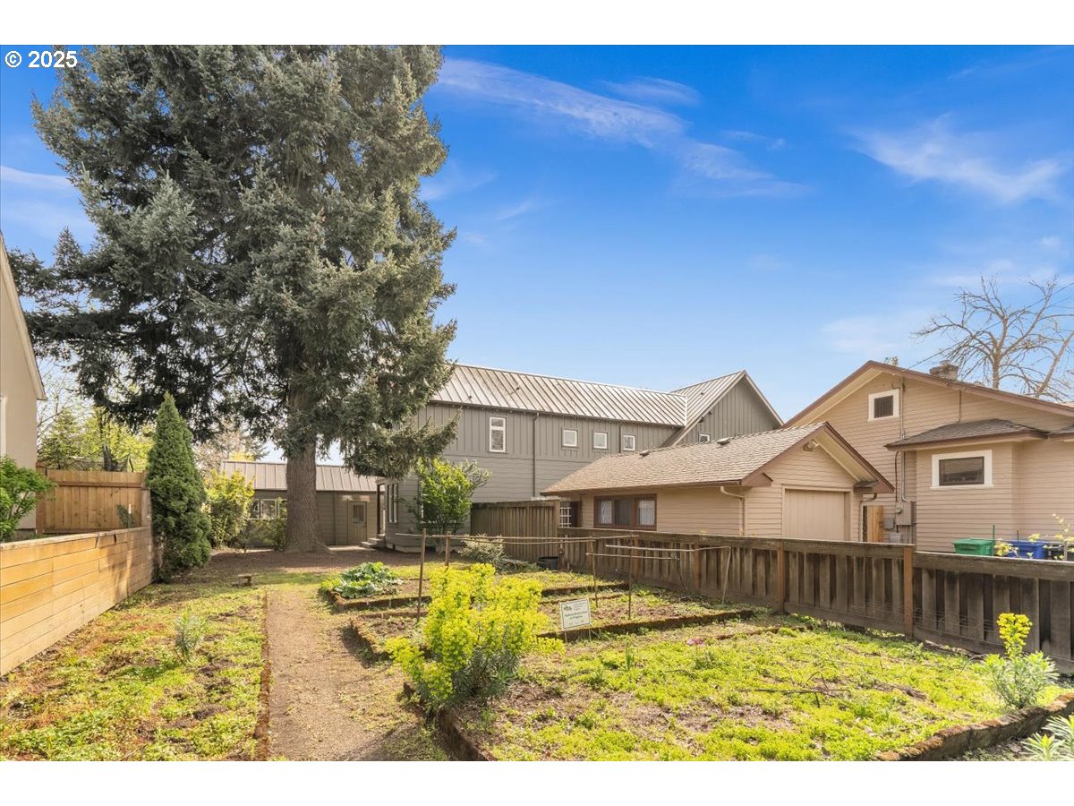 8316 Southeast 7th Avenue Portland, OR 97202 - Photo 36 of 44 a view of a house with swimming pool and a yard