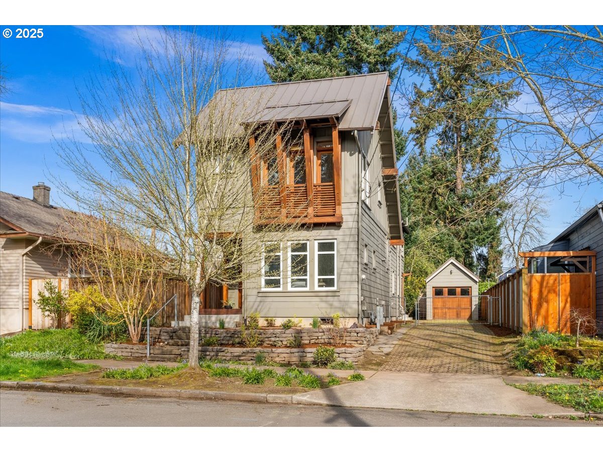 8316 Southeast 7th Avenue Portland, OR 97202 - Photo 44 of 44 a front view of a house with garden