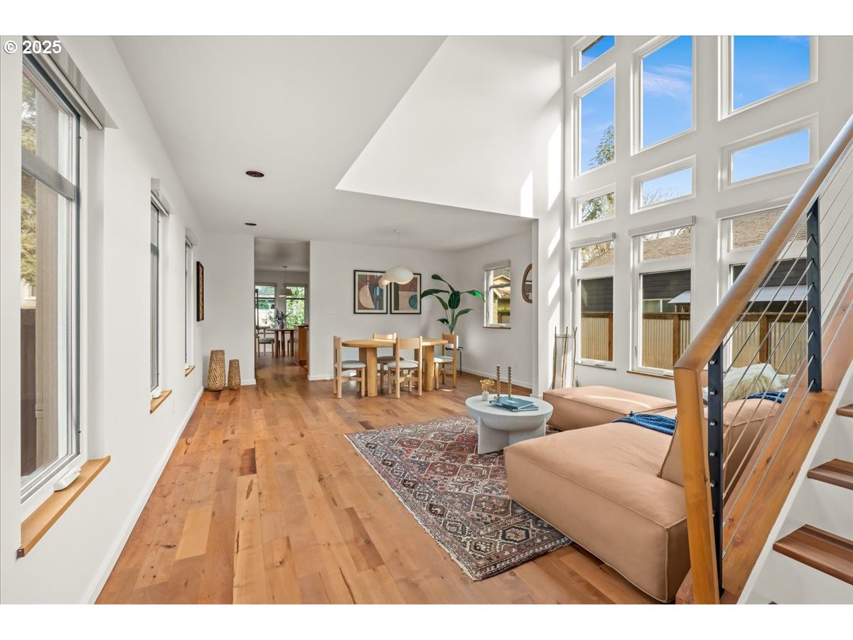 8316 Southeast 7th Avenue Portland, OR 97202 - Photo 5 of 44 a living room with furniture and a wooden floor