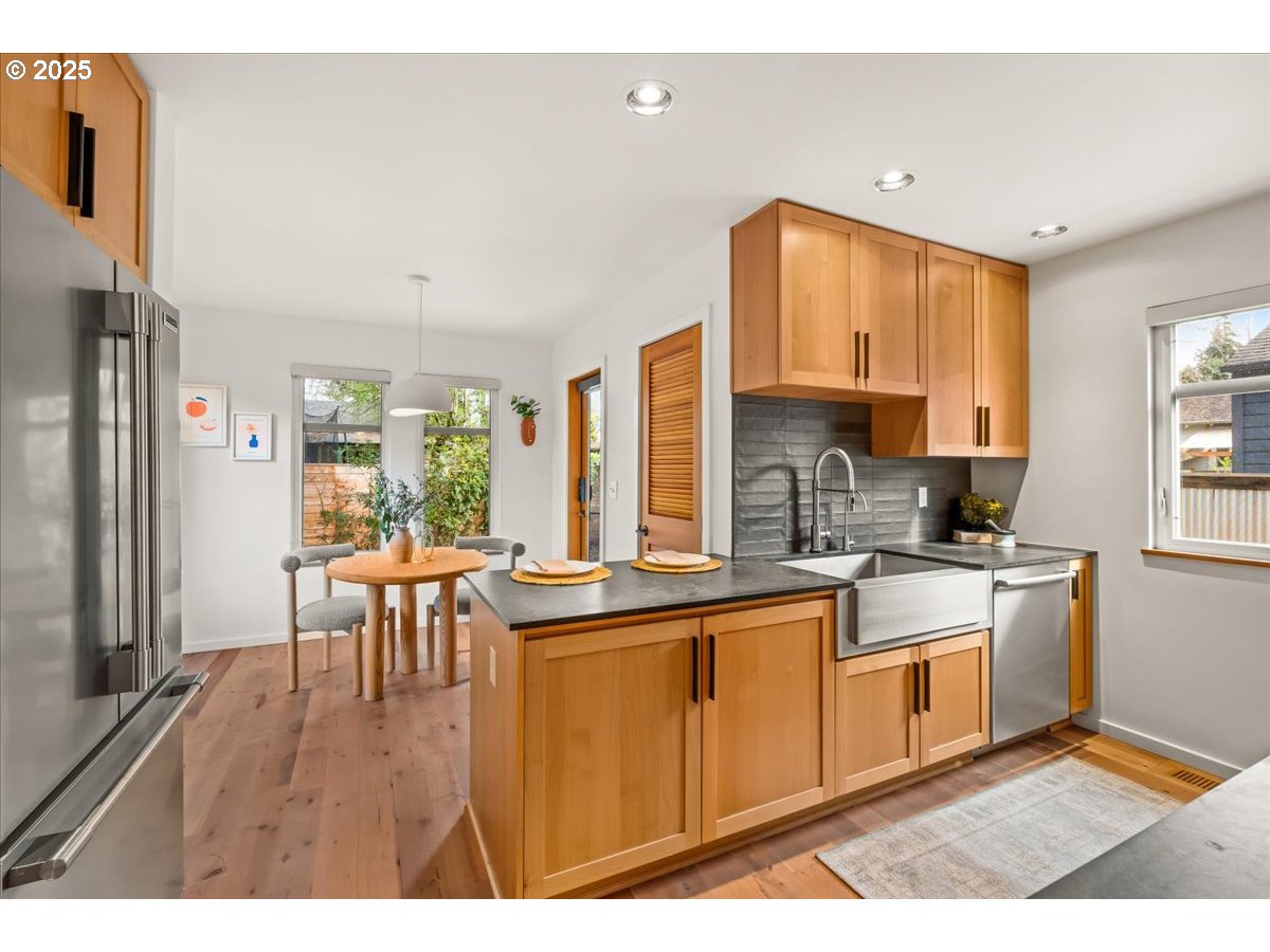 8316 Southeast 7th Avenue Portland, OR 97202 - Photo 9 of 44 a kitchen with a sink cabinets and window