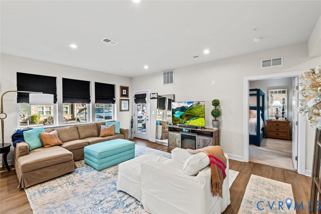 6655 Citory Way, Unit 103 Moseley, VA 23120 - Photo 11 of 48 a living room with furniture and a flat screen tv