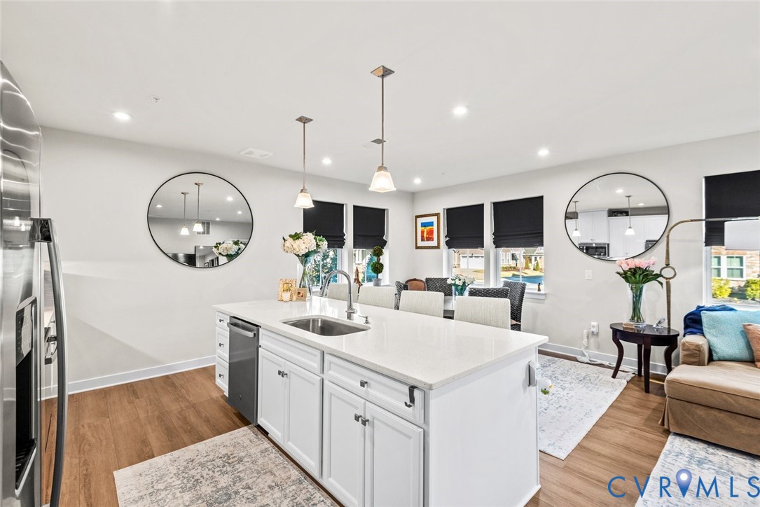 6655 Citory Way, Unit 103 Moseley, VA 23120 - Photo 47 of 48 a living room with furniture a mirror and a large window