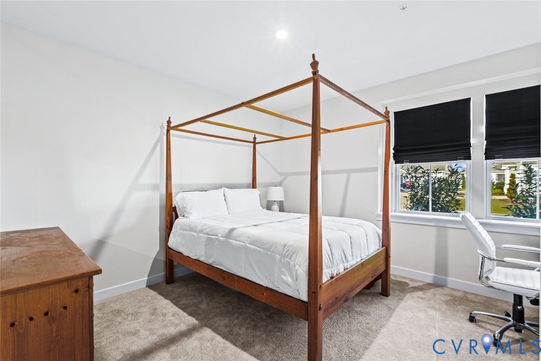 6655 Citory Way, Unit 103 Moseley, VA 23120 - Photo 21 of 48 a bedroom with a bed and a window