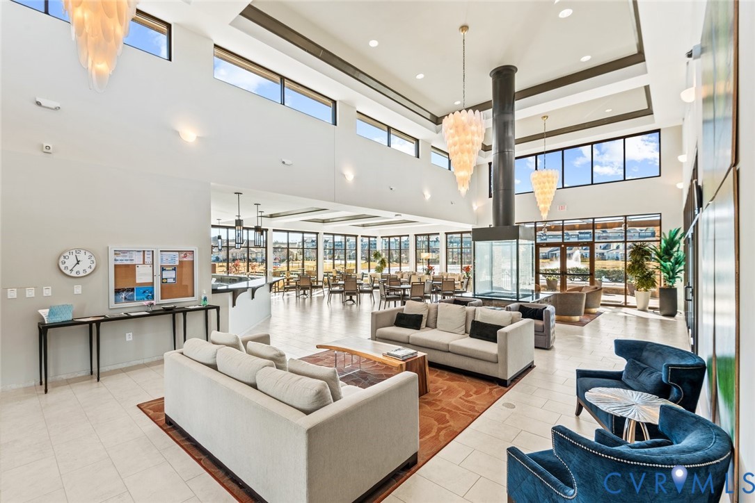 6655 Citory Way, Unit 103 Moseley, VA 23120 - Photo 28 of 48 a living room with furniture and a large window
