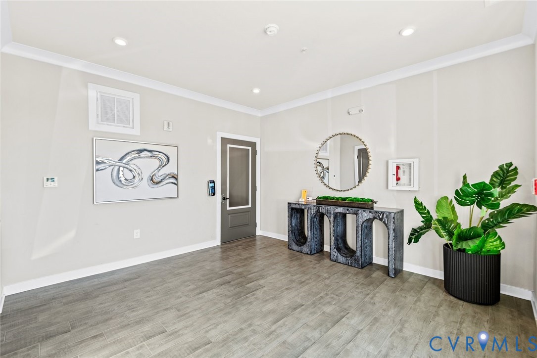 6655 Citory Way, Unit 103 Moseley, VA 23120 - Photo 34 of 48 a living room with furniture and a wooden floor