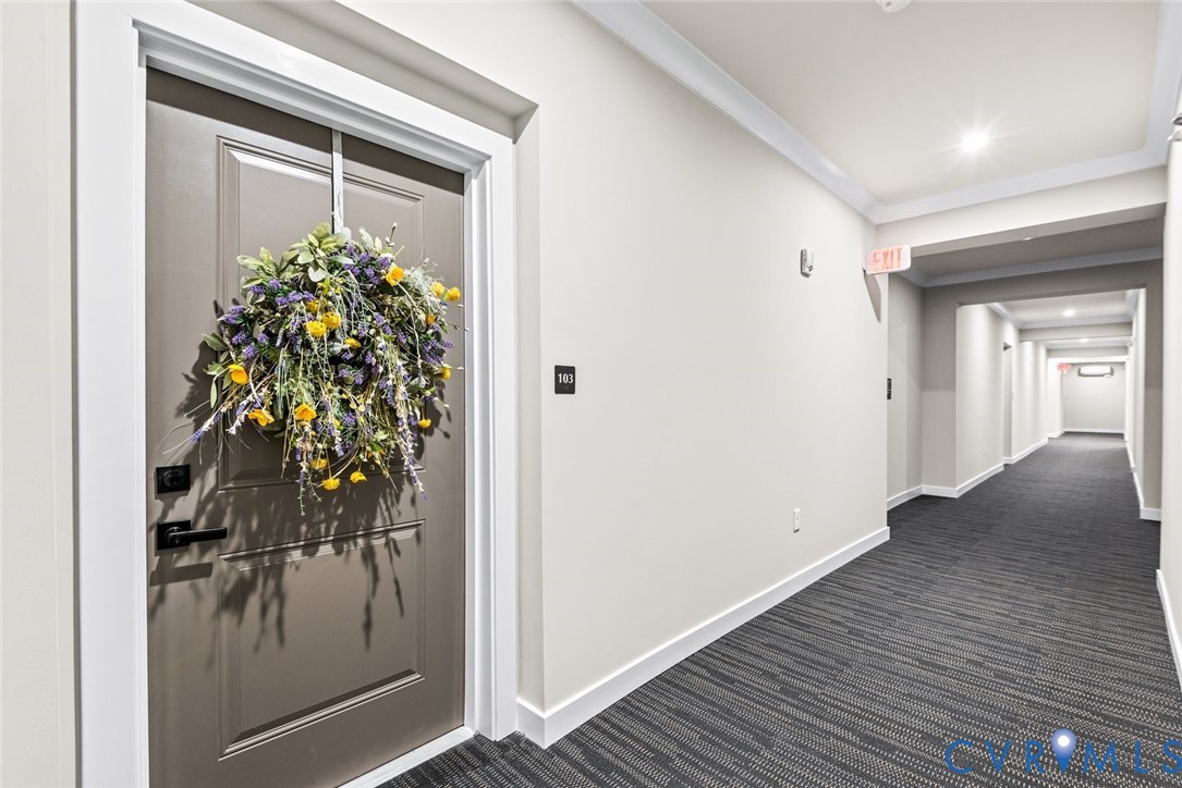 6655 Citory Way, Unit 103 Moseley, VA 23120 - Photo 4 of 48 a hallway with wooden door and glass door