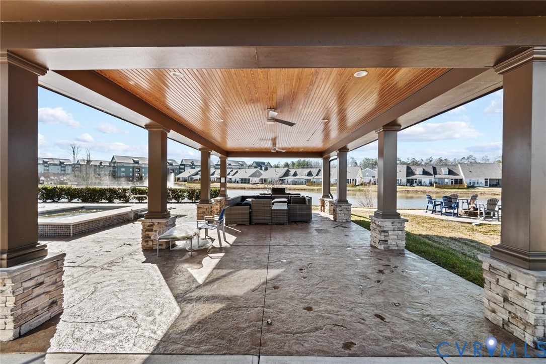 6655 Citory Way, Unit 103 Moseley, VA 23120 - Photo 45 of 48 a living room with furniture and a floor to ceiling window