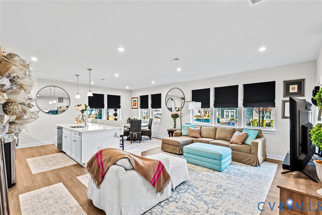 6655 Citory Way, Unit 103 Moseley, VA 23120 - Photo 8 of 48 a living room with furniture and a flat screen tv