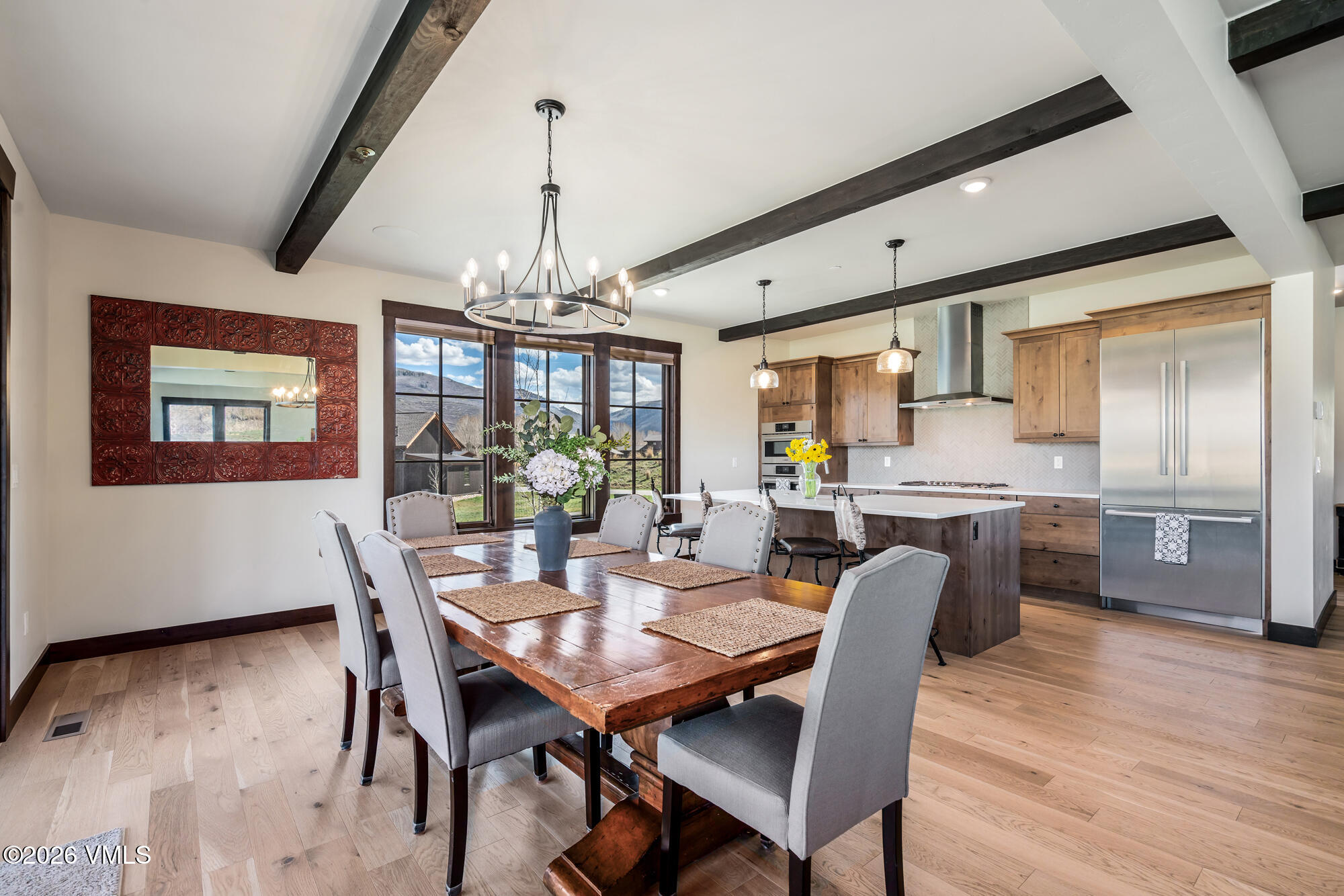 481 Hunters View Lane Eagle, CO 81631 - Photo 21 of 49 a dining room with furniture a chandelier and wooden floor