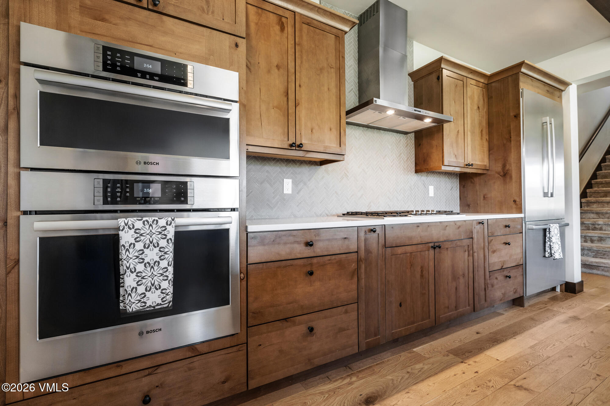 481 Hunters View Lane Eagle, CO 81631 - Photo 25 of 49 a kitchen with stainless steel appliances granite countertop a stove microwave and cabinets