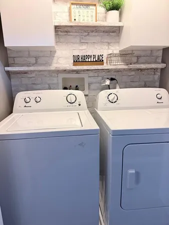 a utility room with washer and dryer
